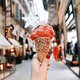 hand holding icecream at street